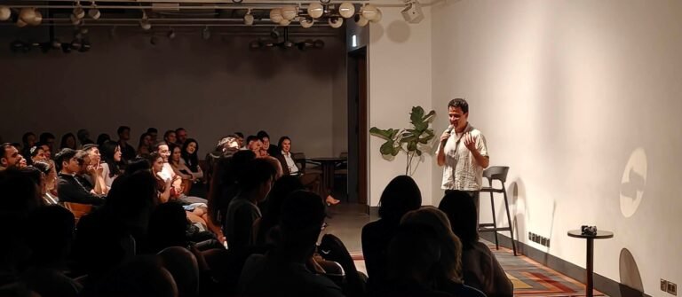 Comedian Angus Cheng performing to crowd